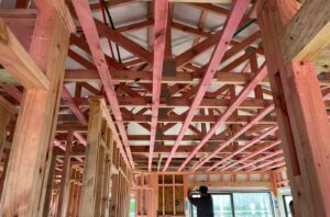 Homeowner reviewing construction after frame completion stage
