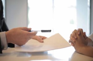 Mortgage adviser reviewing a home loan application with a borrower after a bank decline