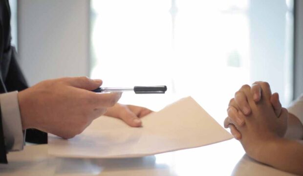 Mortgage adviser reviewing a home loan application with a borrower after a bank decline